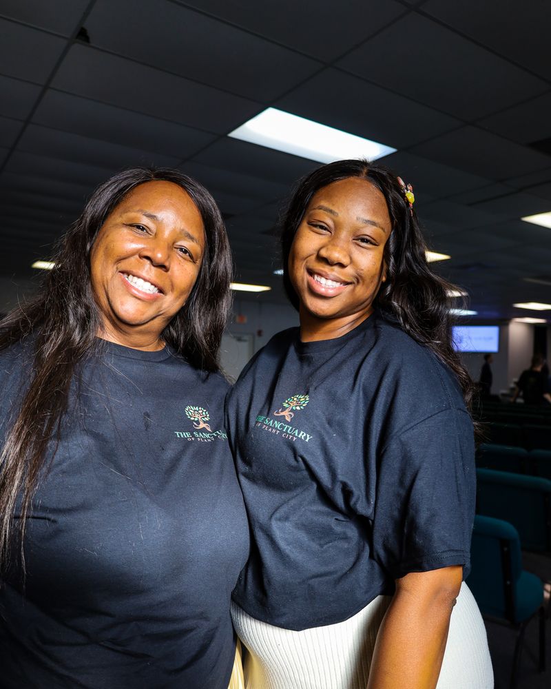 Two smiling members of The Sanctuary of Plant City