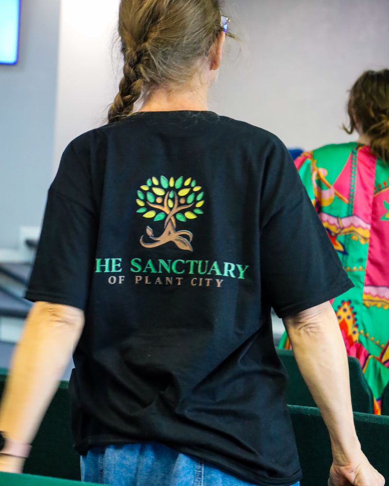 A member wearing a Sanctuary of Plant City shirt